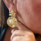 Jakris vintage-inspired gold statement earrings featuring a large central pearl in a textured couture design