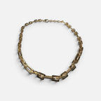 Jakris gold plated modern chain choker necklace with thick rectangular links on a white background