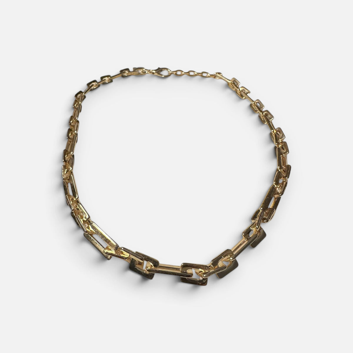 Jakris gold plated modern chain choker necklace with thick rectangular links on a white background