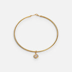 Jakris gold-plated choker necklace featuring a delicate round solitaire pendant on a minimalist metal band