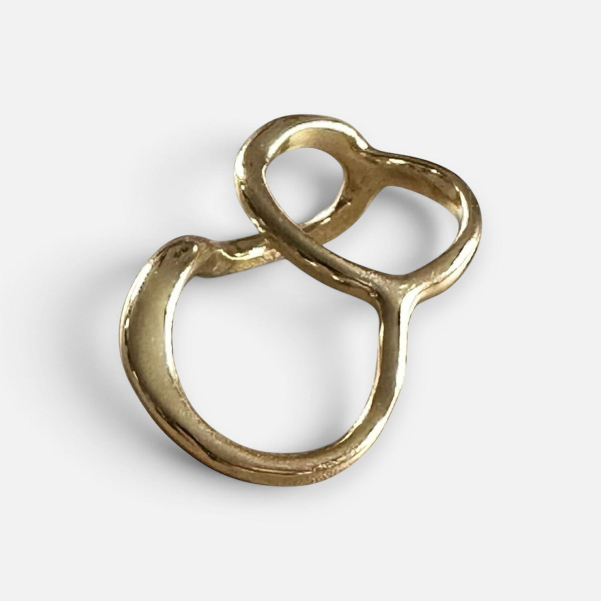 Jakris gold-plated two-finger ring with a modern sculptural design and smooth polished finish