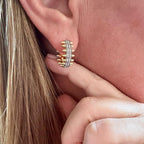 Jakris gold hoop earring featuring a central row of sparkling zircon crystals and edgy spike details on the sides.