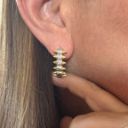 Jakris gold-plated hoop earrings featuring a zigzag spiked edge and sparkling cubic zirconia stone accents