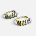 Jakris gold-plated hoop earrings featuring a zigzag spiked design and cubic zirconia accents.