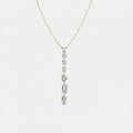 Jakris gold necklace featuring a vertical drop design with various shaped clear stones on a delicate chain