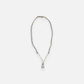 Jakris elegant gold necklace featuring a delicate chain and a single teardrop pearl pendant