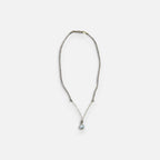 Jakris elegant gold necklace featuring a delicate chain and a single teardrop pearl pendant