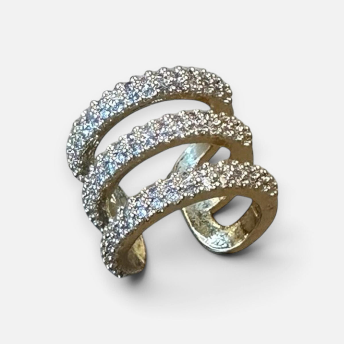 Jakris gold-tone triple-row cartilage ear cuff featuring sparkling zircon stones in an adjustable design.