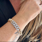 Jakris gold chain bracelet featuring a thick link design adorned with sparkling white zircon stones on a woman's wrist