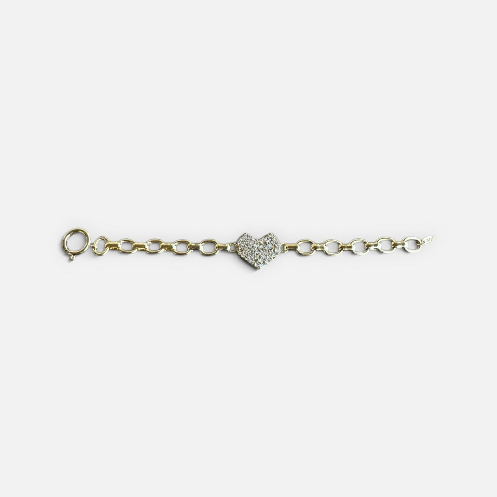 Jakris gold chain bracelet featuring a central heart charm encrusted with sparkling zircon crystals.