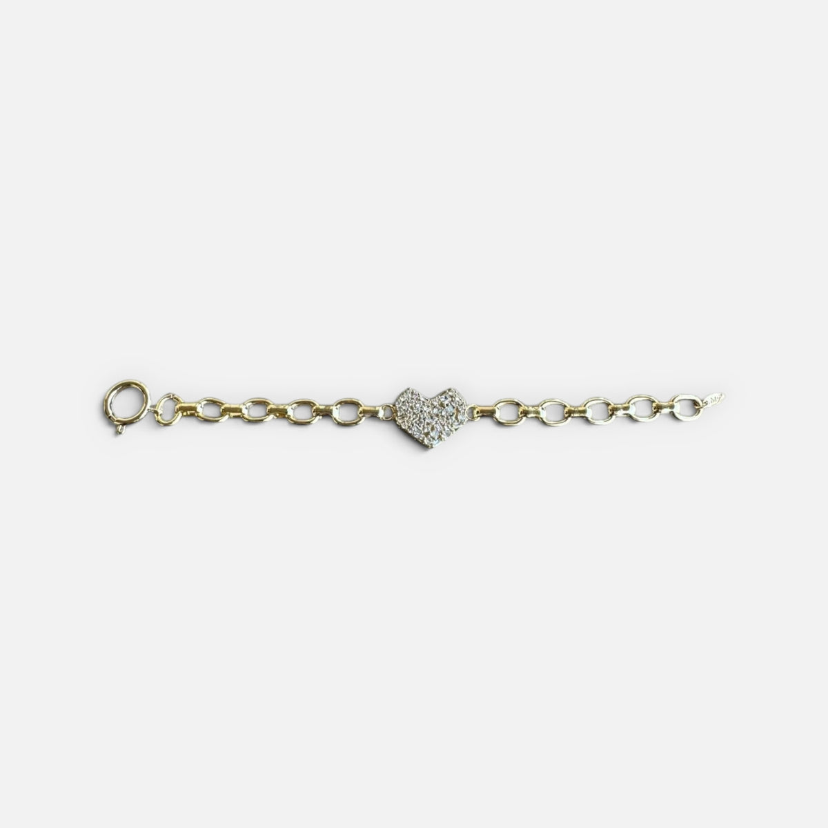 Jakris gold chain bracelet featuring a central heart charm encrusted with sparkling zircon crystals.