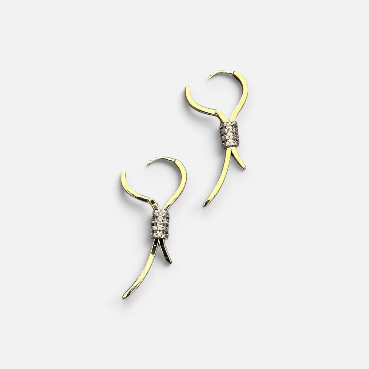 Jakris elegant gold drop earrings featuring a ribbon design with sparkling zircon stone accents