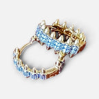 Jakris gold hoop earrings featuring sparkling zircon crystals and edgy pointed spike details