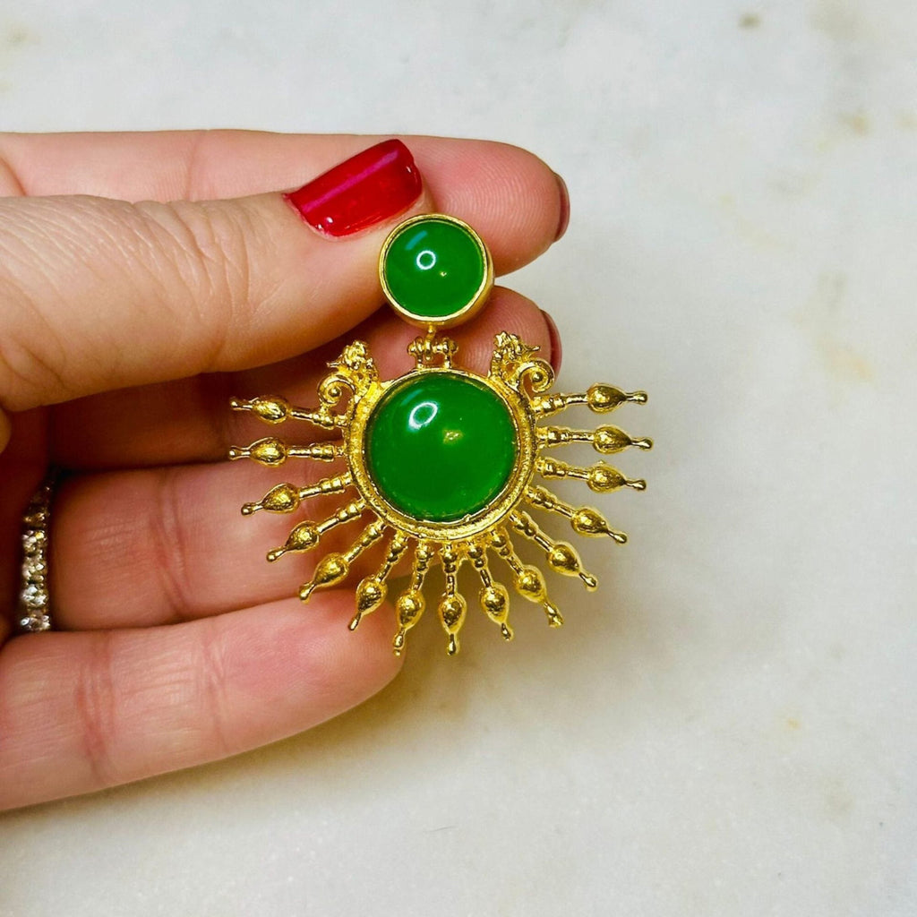 Jakris green onyx stone drop earrings with 24k gold plated sun design held in hand