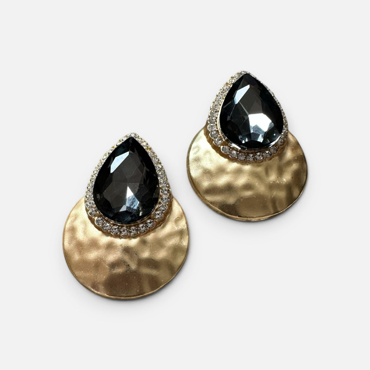 Jakris teardrop evening earrings featuring large grey crystals set in gold-toned hammered metal with rhinestone trim