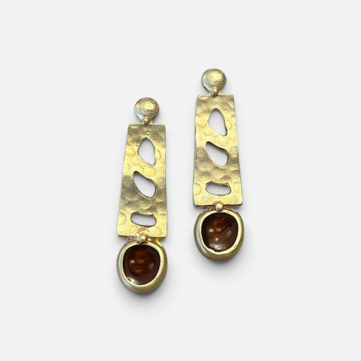 Jakris gold-tone drop earrings featuring a hammered metal texture and brown stone accents in a modern design.