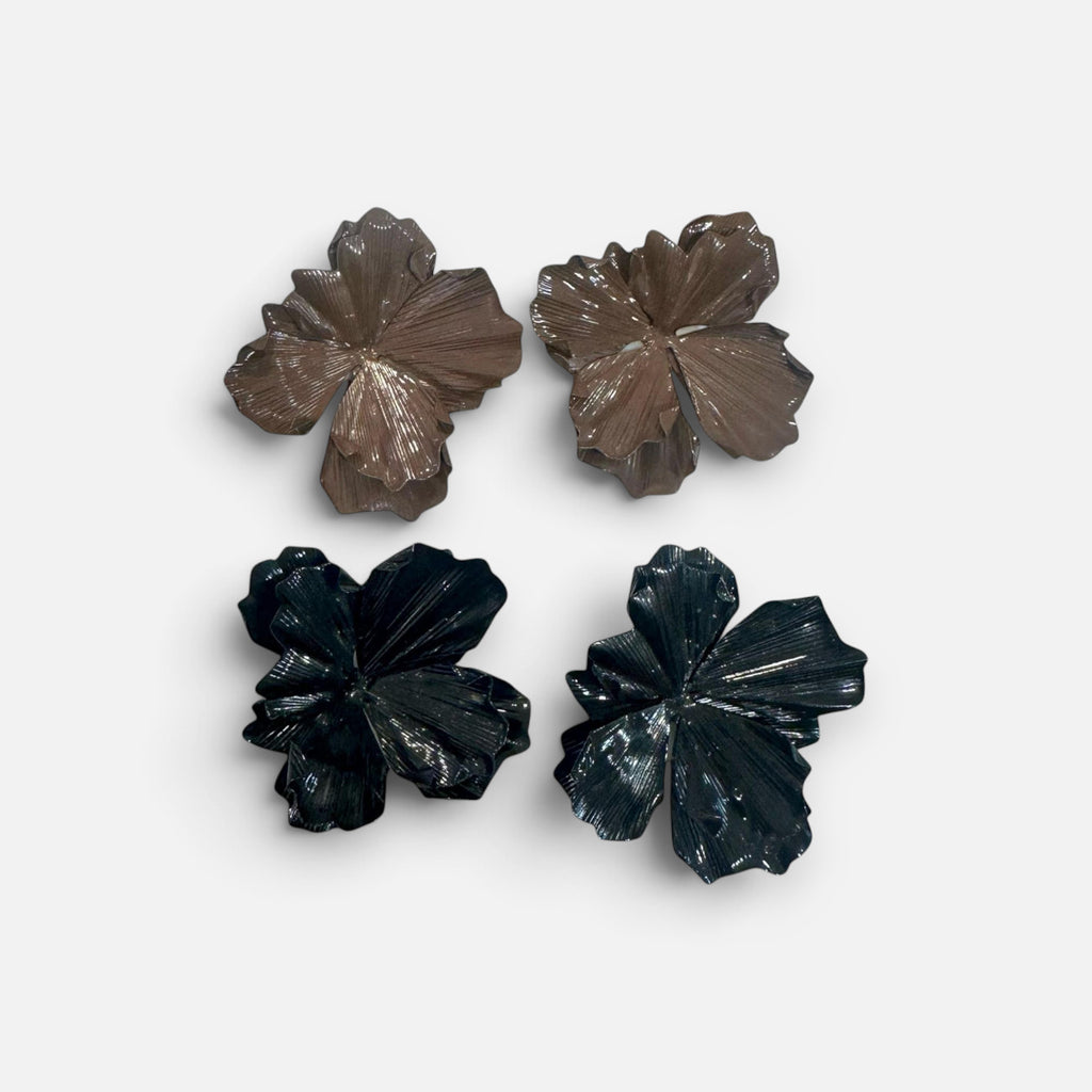 Jakris large flower earrings in brown and black with textured petal details on a white fabric background
