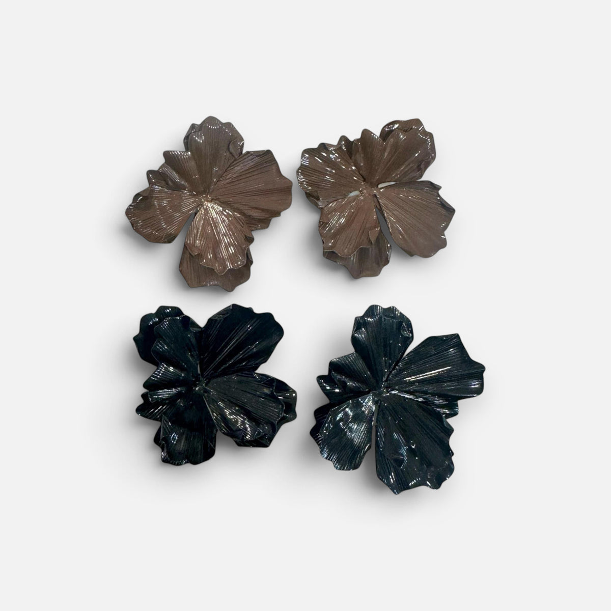 Jakris large flower earrings in brown and black with textured petal details on a white fabric background