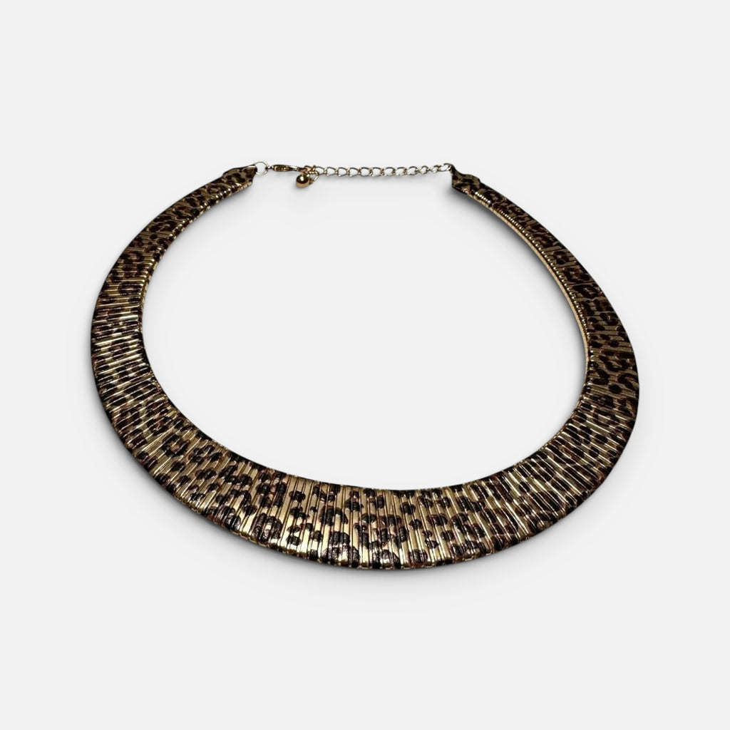 Jakris double-sided choker necklace featuring a leopard print pattern and a textured gold finish