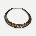 Jakris double-sided choker necklace featuring a leopard print pattern and a textured gold finish