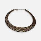 Jakris double-sided choker necklace featuring a leopard print pattern and a textured gold finish