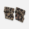 Jakris statement earrings featuring a sculptural, irregular shape with gold-tone, black, and champagne crystal leopard print.