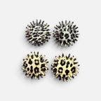 Jakris round earrings with jagged edges featuring black and white leopard and zebra animal print patterns