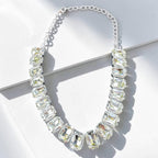 Jakris Liora choker necklace featuring large emerald-cut clear crystals set in a silver-toned adjustable chain.