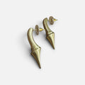 Jakris modern brass earrings featuring a unique pointed, elongated drop design with a brushed gold-tone finish.
