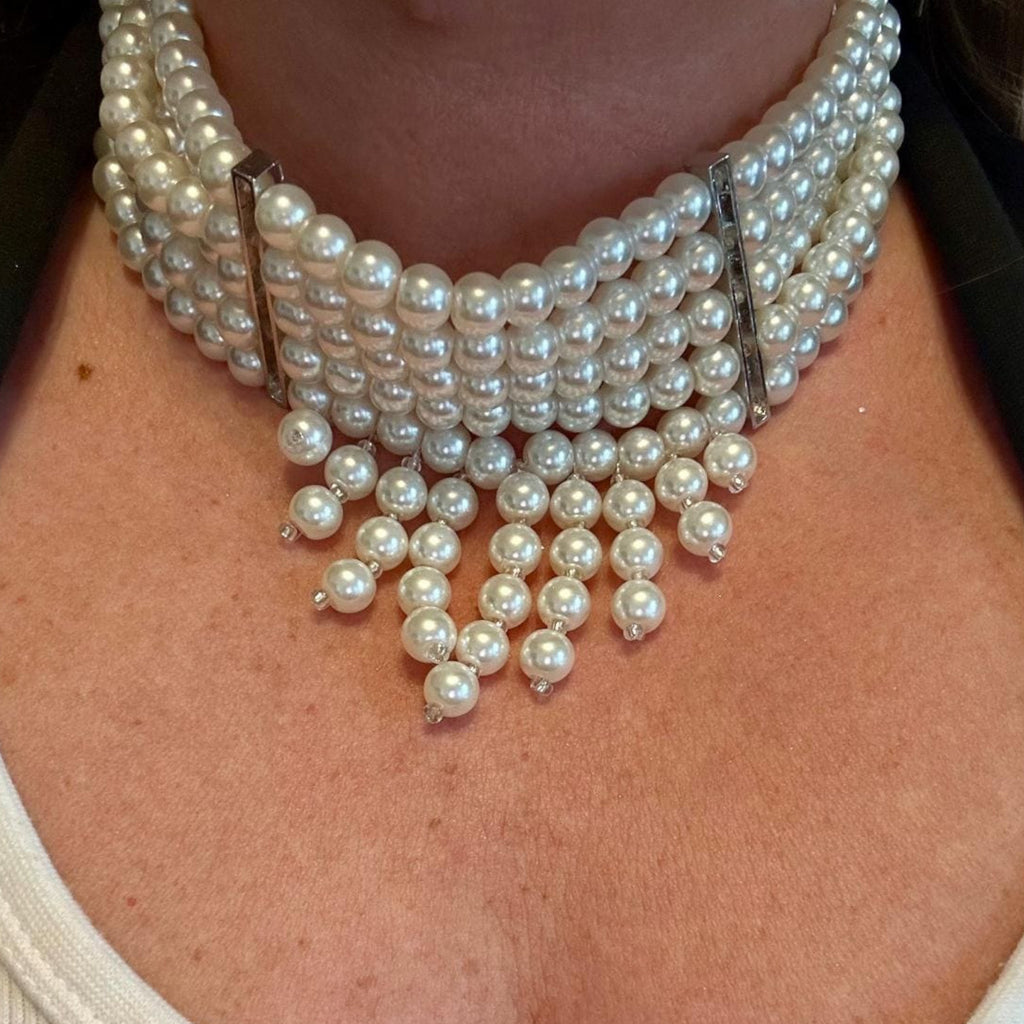 Jakris multi-strand pearl choker necklace featuring elegant dangling pearl accents for bridal or formal wear.