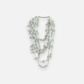 Jakris multi-strand long pearl necklace featuring layered white beads for a bridal or elegant formal look.