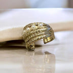 Jakris gold-tone non-pierced ear cuff featuring delicate white pearls and sparkling crystal stone embellishments.