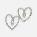 Jakris elegant heart-shaped bridal earrings featuring delicate white pearls in a gold-tone setting