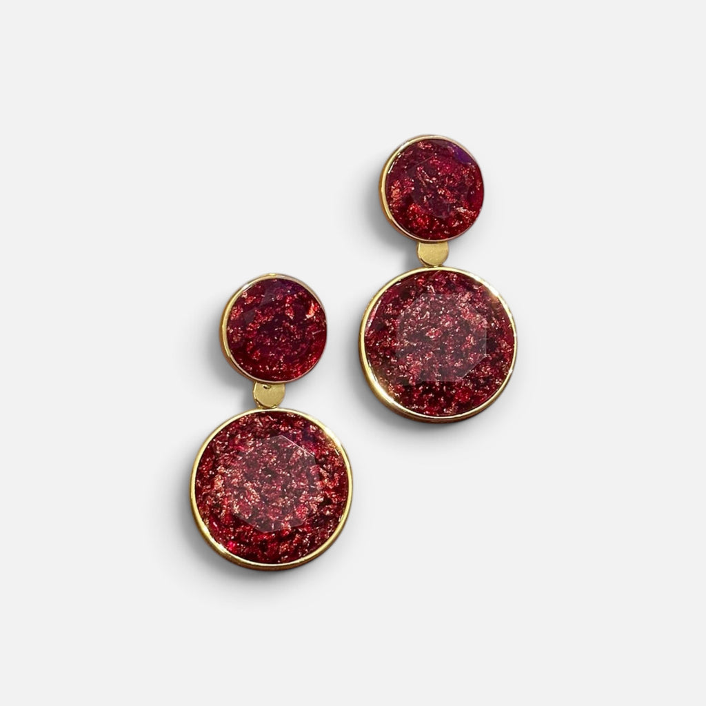Jakris red crystal dangle earrings featuring two circular stones set in polished gold-tone frames