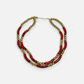 Jakris double-strand necklace featuring red tube beads and gold-toned round beads in a vintage style