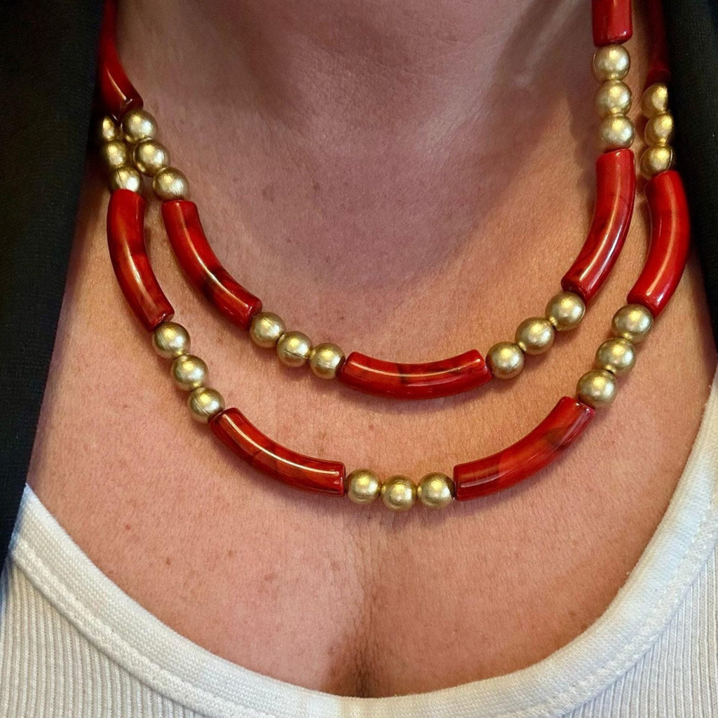 Jakris double-strand necklace featuring bold red tube beads and gold-plated spherical beads in a vintage style.