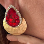 Jakris red teardrop evening earring with a large crystal, rhinestone border, and hammered gold circular base