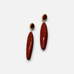 Jakris modern red teardrop earrings with gold accents and a sleek dangling design