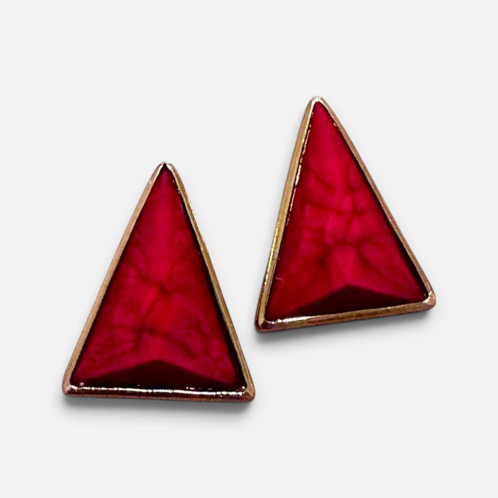 Jakris modern triangle earrings featuring vibrant red stone inlay with a polished gold-tone metal frame