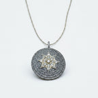 Jakris round pendant necklace featuring a central star motif encrusted with sparkling white zircon stones
