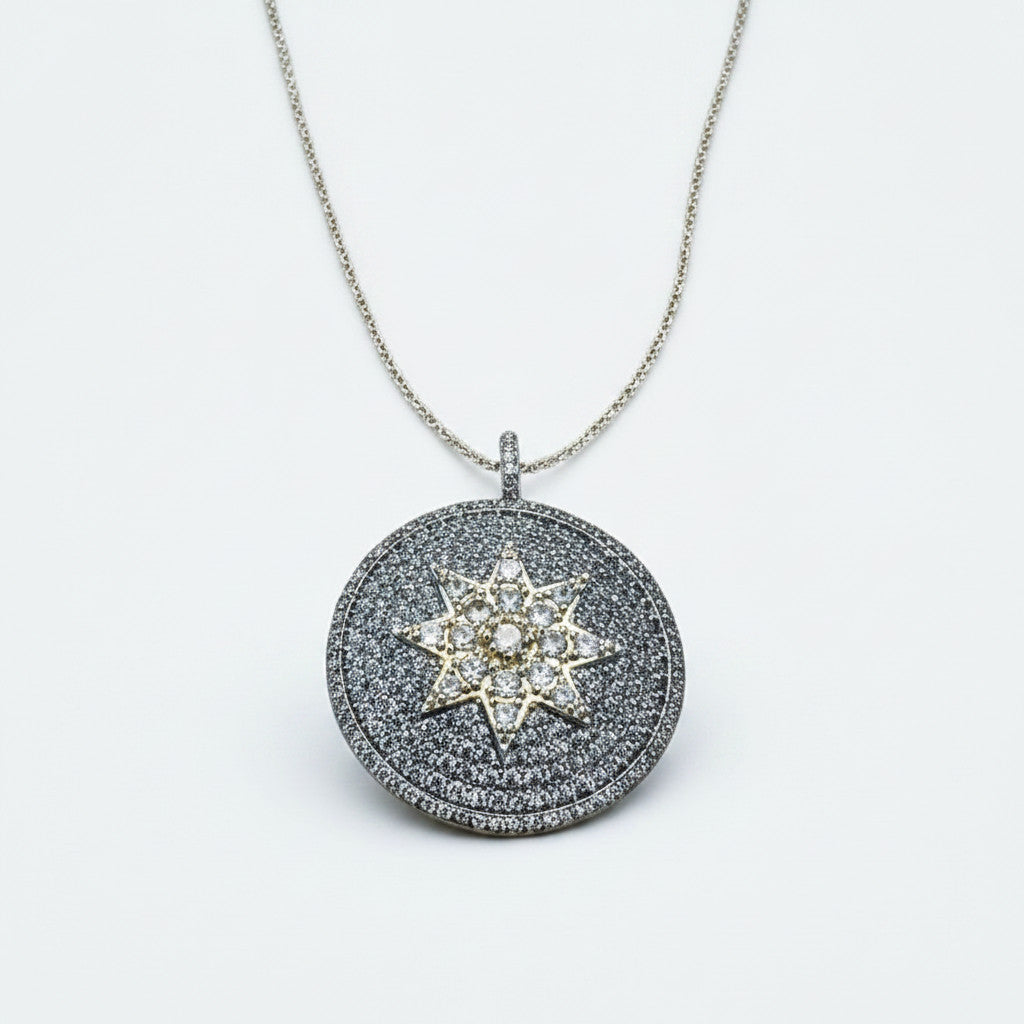 Jakris round pendant necklace featuring a central star motif encrusted with sparkling white zircon stones