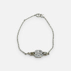 Jakris silver chain bracelet featuring a central geometric pendant with black enamel inlay and sparkling clear stones.