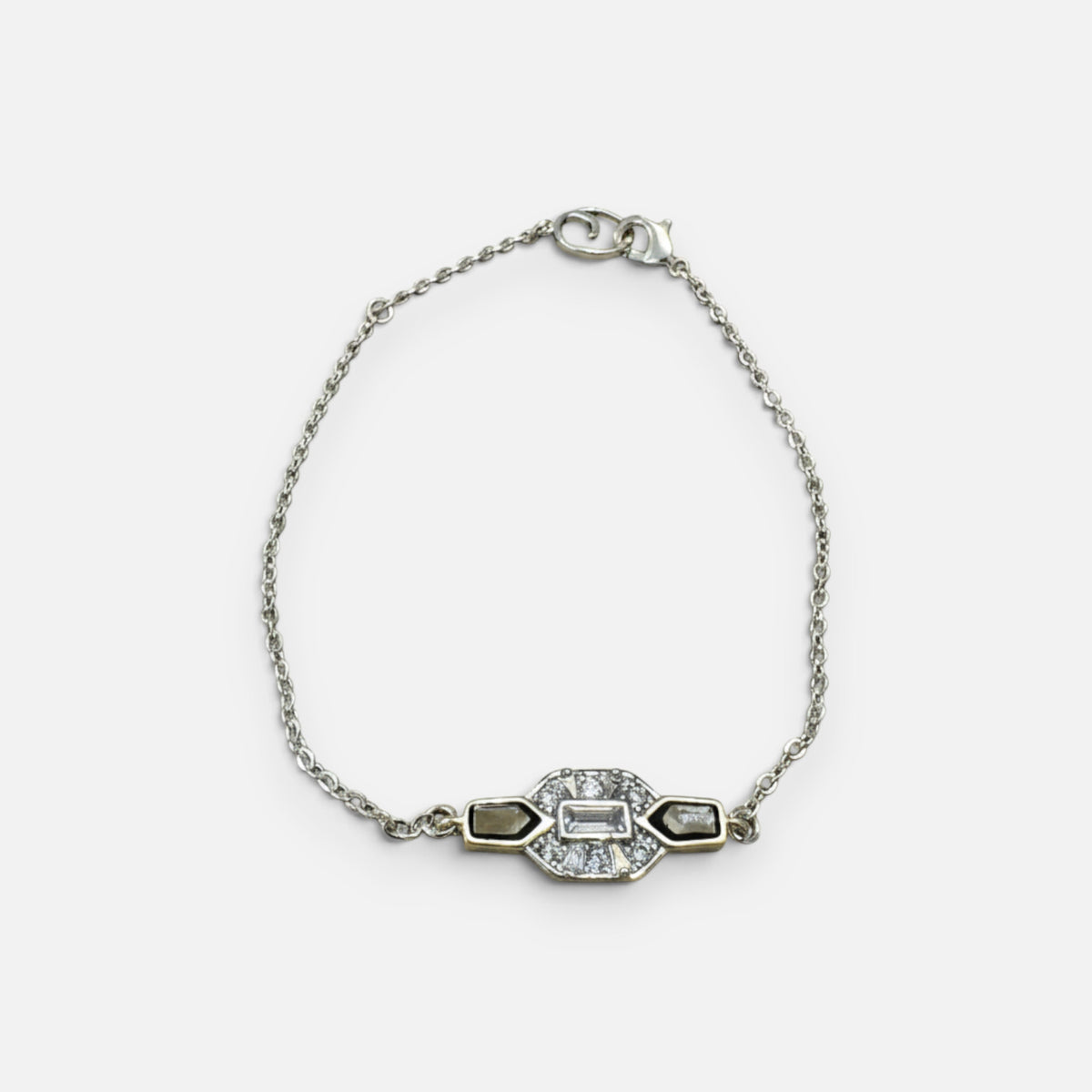 Jakris silver chain bracelet featuring a central geometric pendant with black enamel inlay and sparkling clear stones.