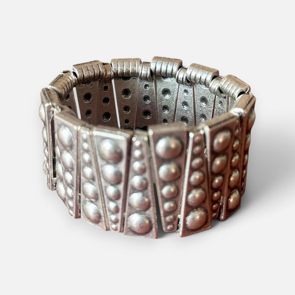 Jakris silver-toned elastic bracelet featuring geometric metal plates with embossed stud details