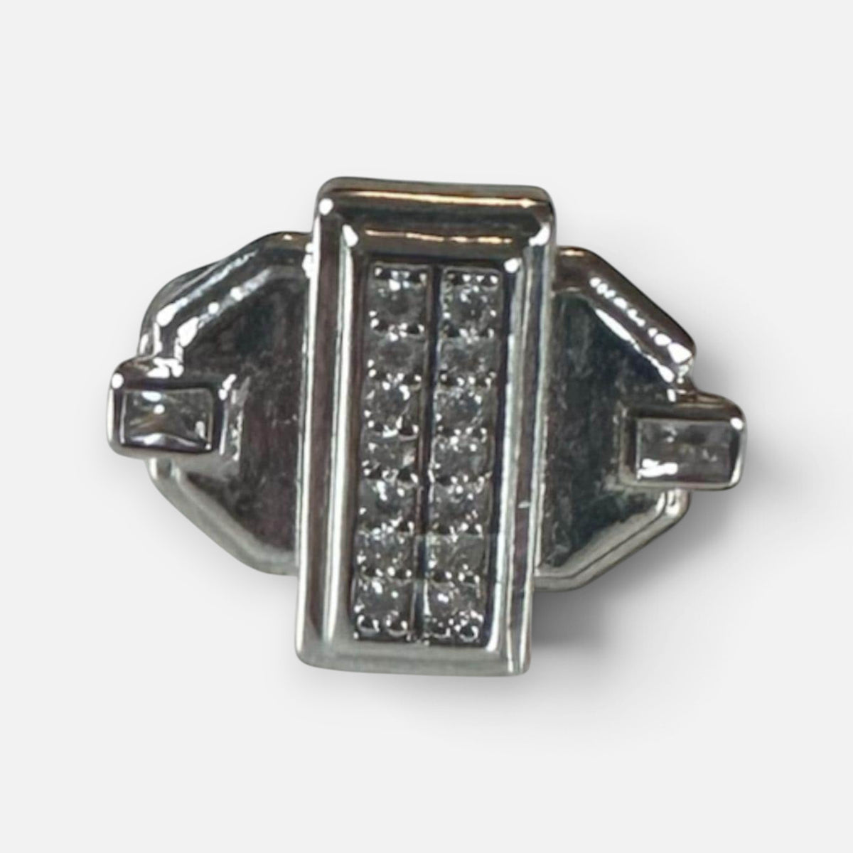 Jakris silver-tone geometric pinky ring featuring a rectangular center with sparkling crystal accents.