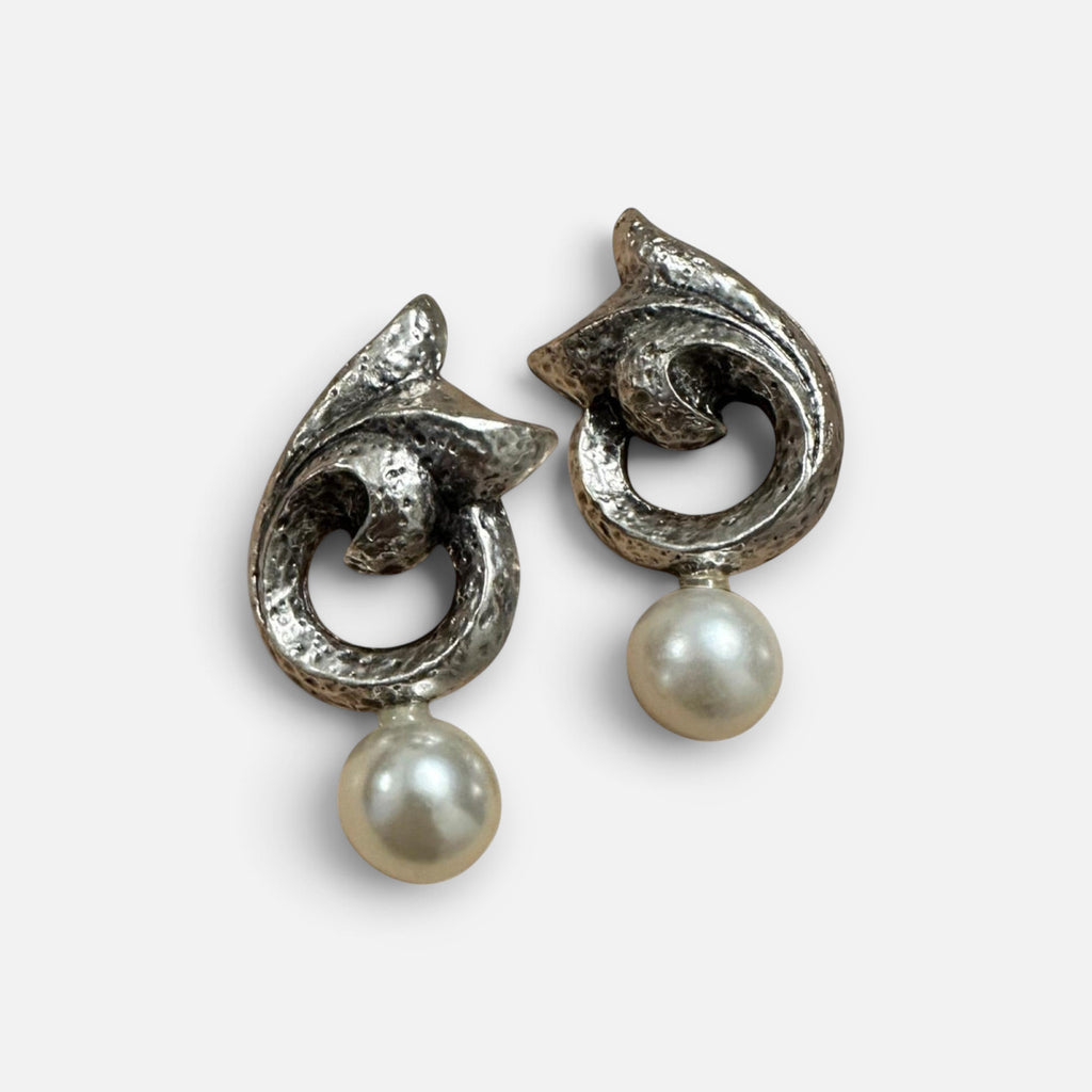 Jakris silver-plated statement earrings with a sculptural textured finish and a dangling faux pearl drop.