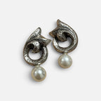 Jakris silver-plated statement earrings with a sculptural textured finish and a dangling faux pearl drop.