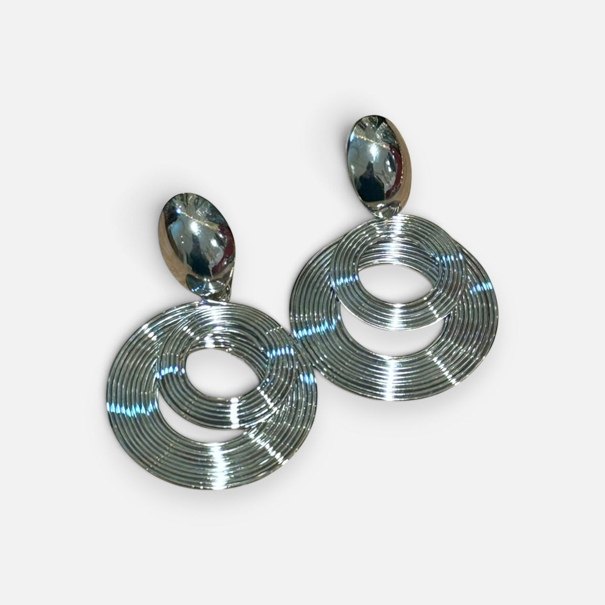 Jakris modern silver spiral dangle earrings with circular layered design