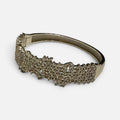 Jakris silver-toned evening bracelet featuring sparkling zircon crystals in a wide, elegant design