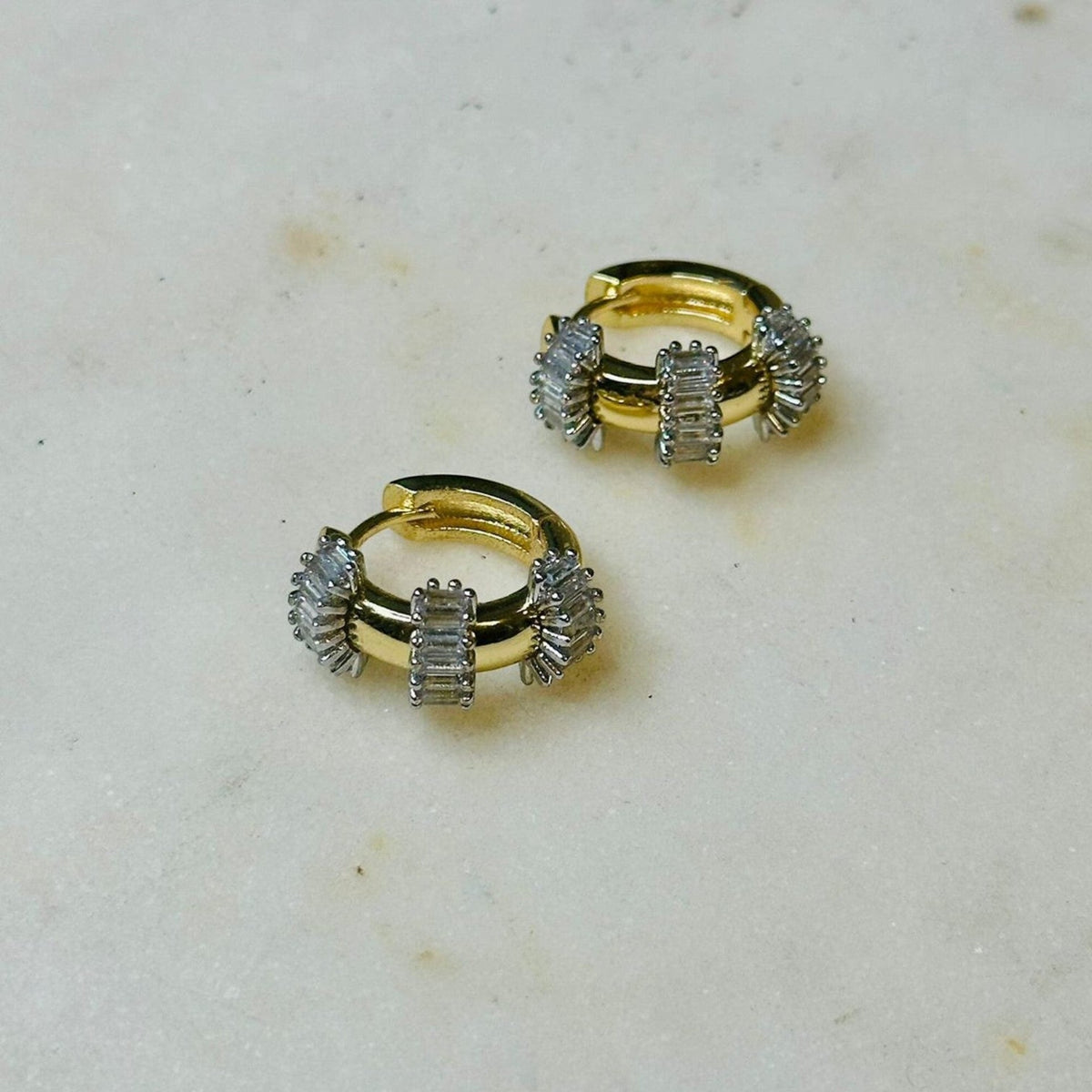 Jakris small gold hoop earrings featuring baguette cut stones, perfect as a gift for Mother's Day.